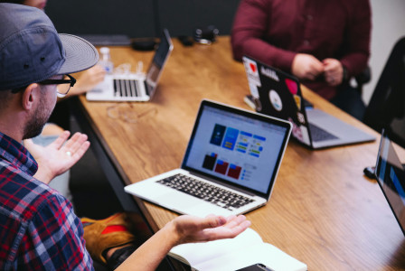 An illustrative photo of a man talking in the online meeting