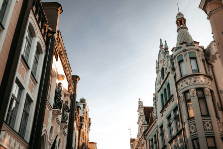 An illustrative photo of a white concrete building.