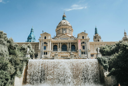 Photo by Unsplash An illustrative photo of a beige building located near waterfalls