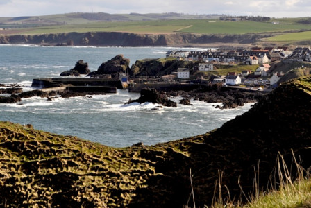 An illustrative photo of a view of a small town by the ocean.
