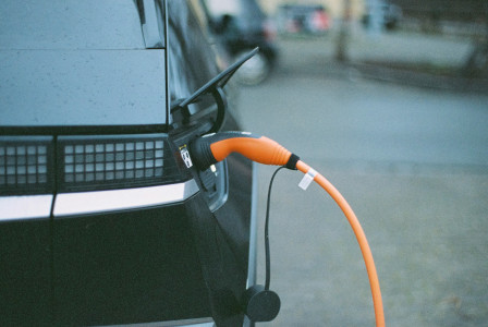 Photo by Unsplash An illustrative photo of an electric car charging