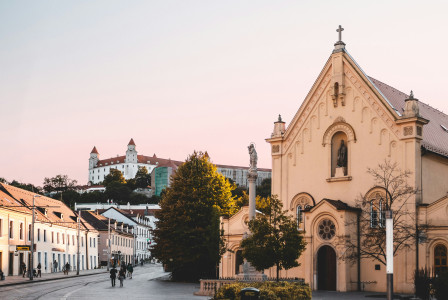 An illustrative photo of a yellow cathedral near the road