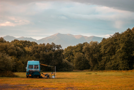 An illustrative photo of a truck parked in a field.