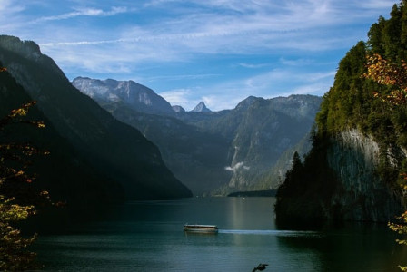 An illustrative photo of mountains and lake.