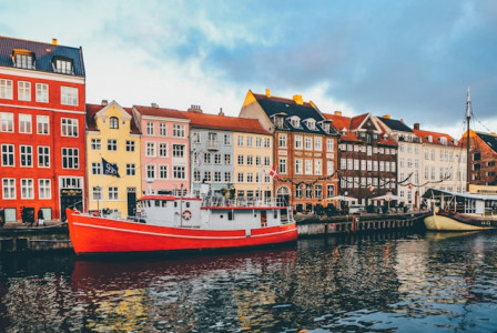 An illustrative photo of buildings in Denmark near a river