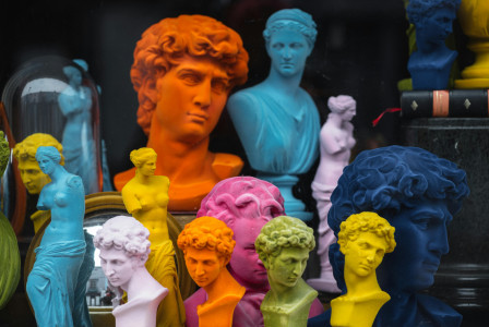 An illustrative photo of colorful busts placed in a store
