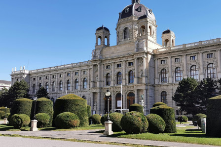 An illustrative photo of light concrete building with big windows