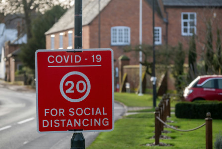 An illustrative photo of a red and white stop road sign