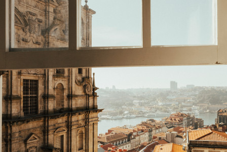 An illustrative photo of an opened window with a view on the city