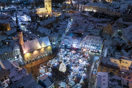 An illustrative photo of an aerial view of a city at night.
