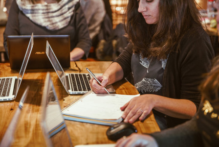An illustrative photo of women learning on the laptops