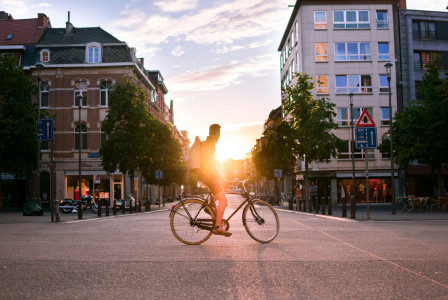 Photo by Unsplash An illustrative photo of a man riding bicycle on road in Belgium