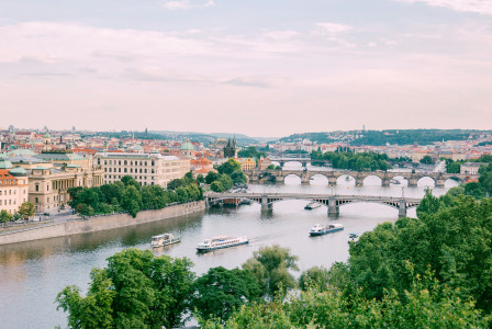 An illustrative photo of three white boats on river in Prague