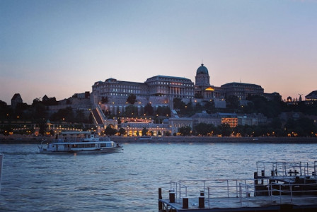 An illustrative photo of Helsinki Cathedral stands illuminated against the night sky.