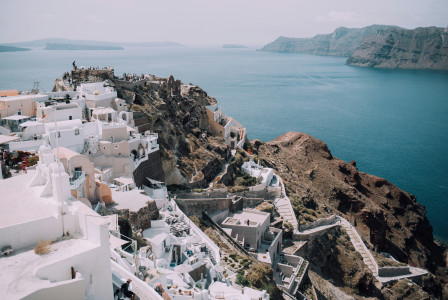 An illustrative photo of a coastal landscape of Santorini, Greece. 