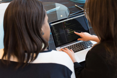 Photo by Unsplash An illustrative photo of two women using a laptop.