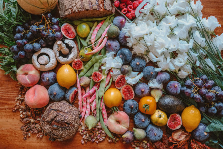 An illustrative photo of assorted fruit and seasoning on table.