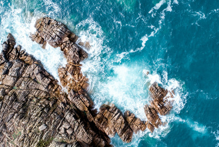 An illustrative photo of a mountain near the ocean.