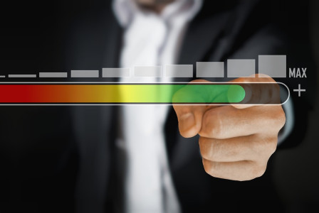 Photo by Pixabay An illustrative photo of a person in a business suit touching a virtual slider bar that transitions from red to green
