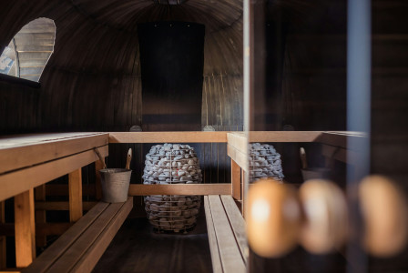 An illustrative photo of the interior of a wooden sauna.