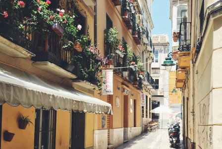 An illustrative photo of a narrow street in Spain
