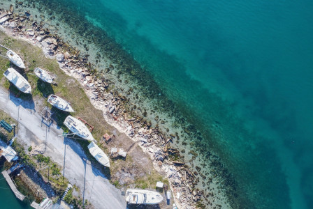 Photo by Unsplash An illustrative photo of several boats docked at a pier