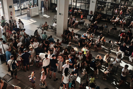 An illustrative photo of a crowd of people in the airport