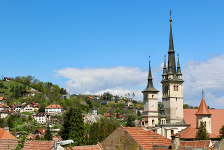 An illustrative photo of a view of a town with a church tower