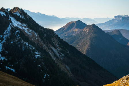 An illustrative photo of a mountain range with snow on the mountains