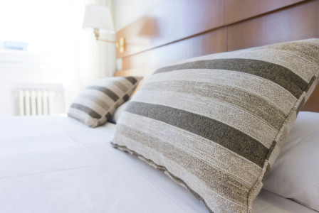 Photo by Unsplash An illustrative photo of pillows on bed.