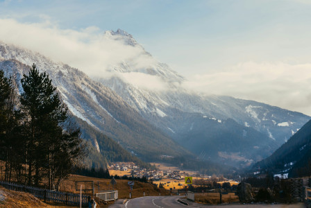 An illustrative photo of a road with a mountain in the background.