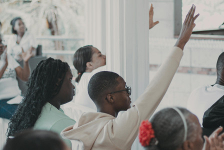 An illustrative photo of a group of people engaged in interactive meeting
