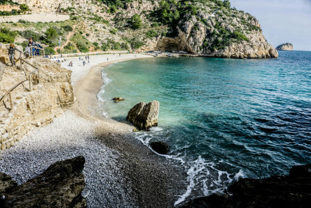 An illustrative photo of a beach with the hill in the background