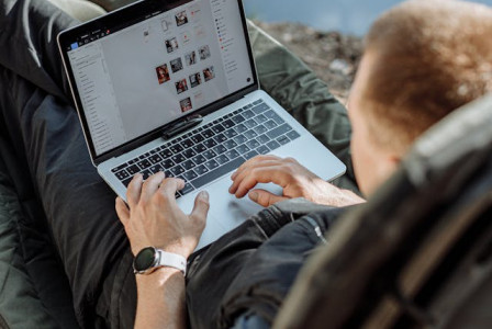 An illustrative photo of an individual using a laptop