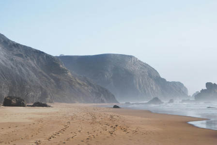 Photo by Pexels An illustrative photo of mountains near body of water.