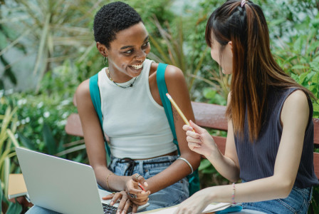 An illustrative photo of female students working on assignment