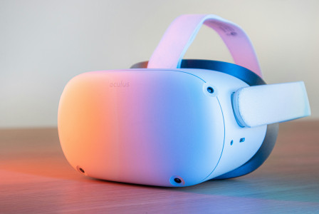 An illustrative photo of pink and white VR goggles