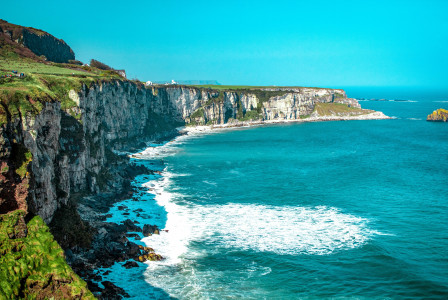 Photo by Unsplash An illustrative photo of a white rock cliff beside body of water