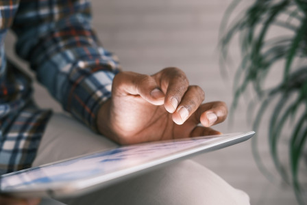 Photo by Unsplash An illustrative photo of a person using a tablet.