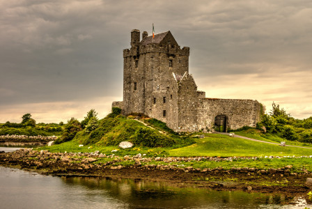 An illustrative photo of a gray castle on an island