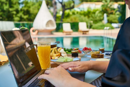 An illustrative photo of a serene outdoor setting with a laptop on a table