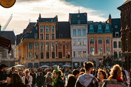 An illustrative photo of a group of people walking in a city.