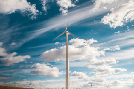 An illustrative photo of a windmill under a cloudy sky