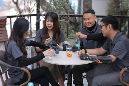 An illustrative photo of people with disabilities sitting at the table