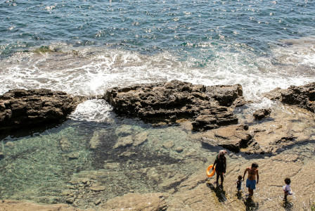 An illustrative photo of a family on the beach