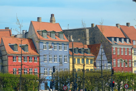 An illustrative photo of a row of colorful houses in Copenhagen