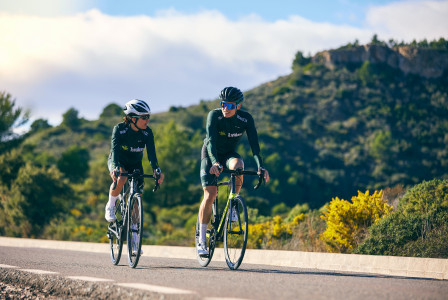 Photo by Unsplash An illustrative photo of a couple of people riding bikes down a road