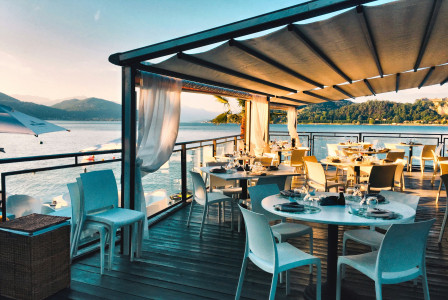 Photo by Unsplash An illustrative photo of a restaurant with a view of the water.