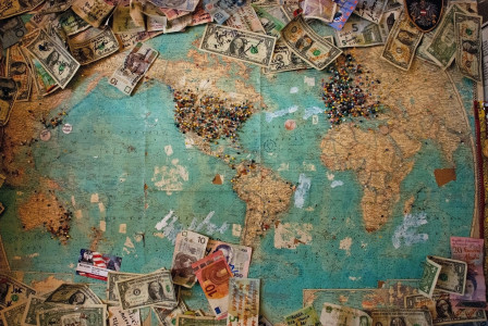 Photo by Unsplash An illustrative photo of a dollar banknote with map