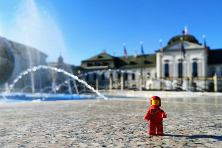 An illustrative photo of a lego figure near a fountain